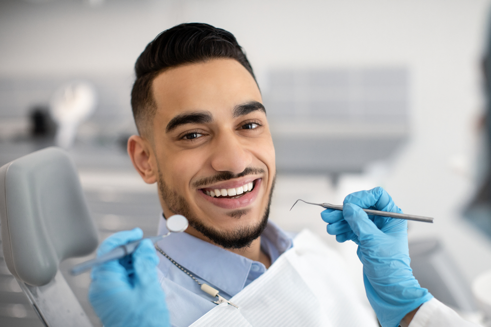 Smiling Patient Receiving Dental Checkup – Restorative Dentistry Long Beach